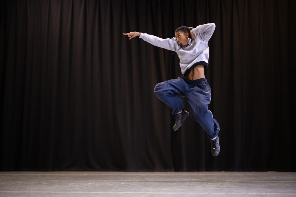 Dancer jumping in the air pointing